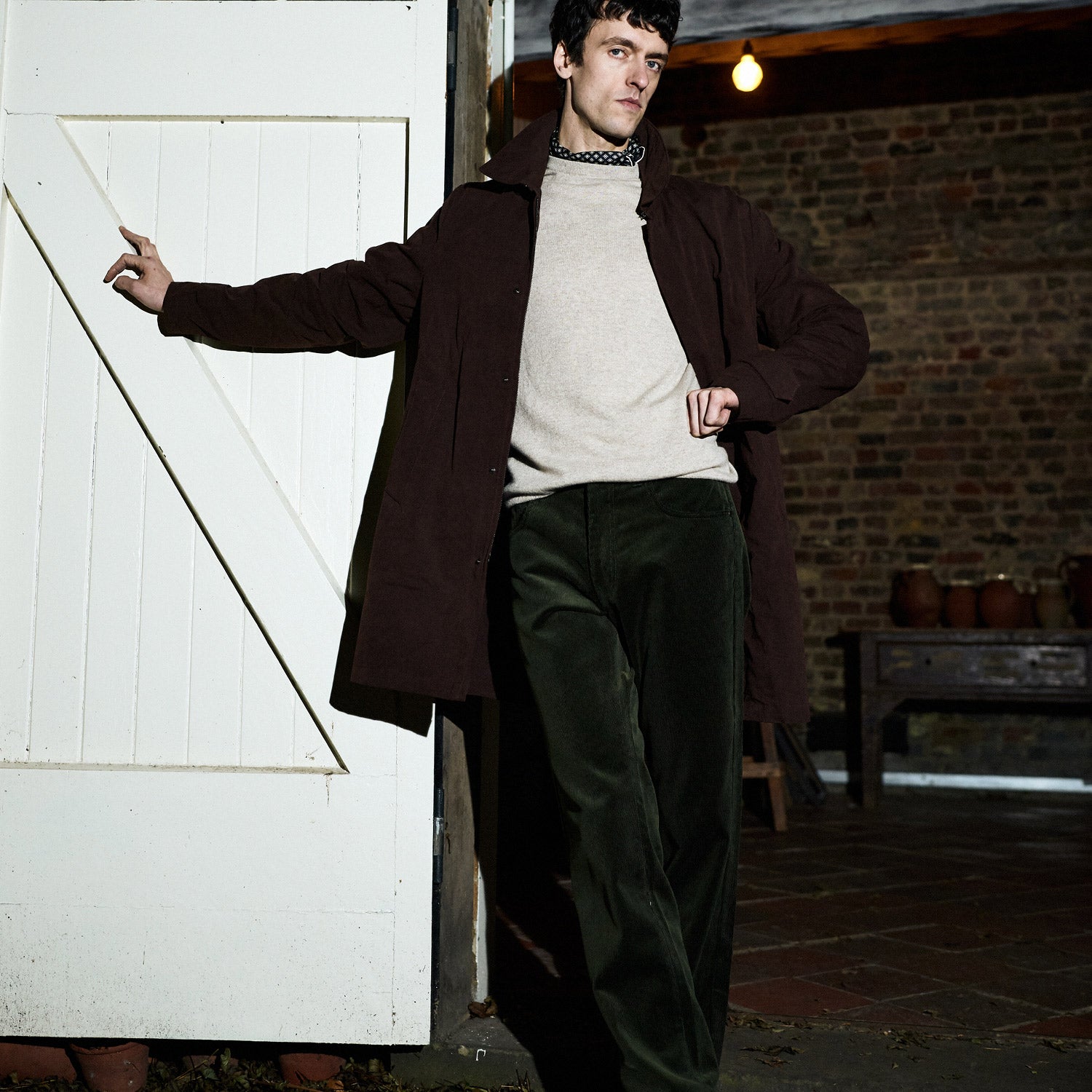 View 2 of product The Burgundy Grayson Car Coat by Turnbull & Asser, made from a rain-resistant cotton blend with a collar, hidden front buttons, and slanted pockets, is displayed flat on a white background in a minimalist style.