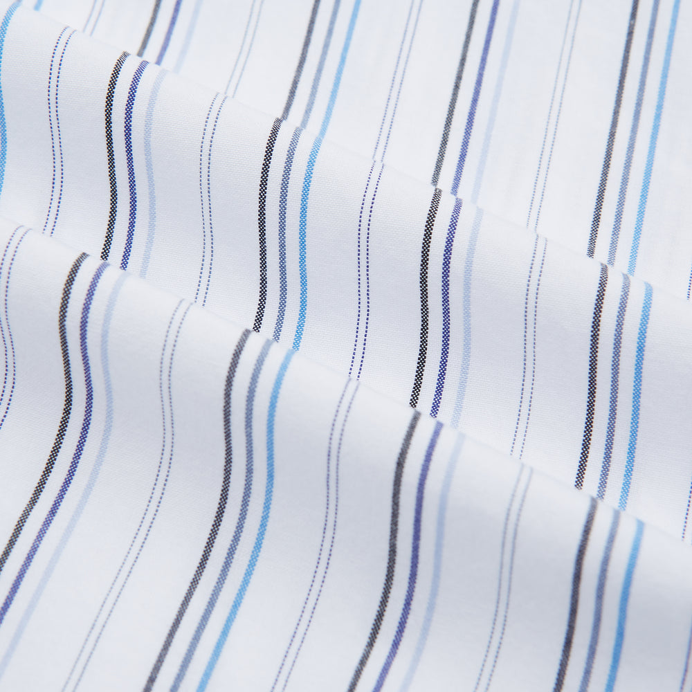 The Turnbull & Asser Blue Fine Multi Pinstripe Mayfair Shirt features long sleeves, an organic cotton build, a T&A collar, and vertical blue stripes. Laid neatly on a white background.