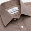 View 4 of product The Turnbull & Asser Camel Cotton Melange Regular Fit Mayfair Shirt features long sleeves, a classic T&A collar, white buttons, and buttoned cuffs in light brown cotton melange, displayed flat on a white background.