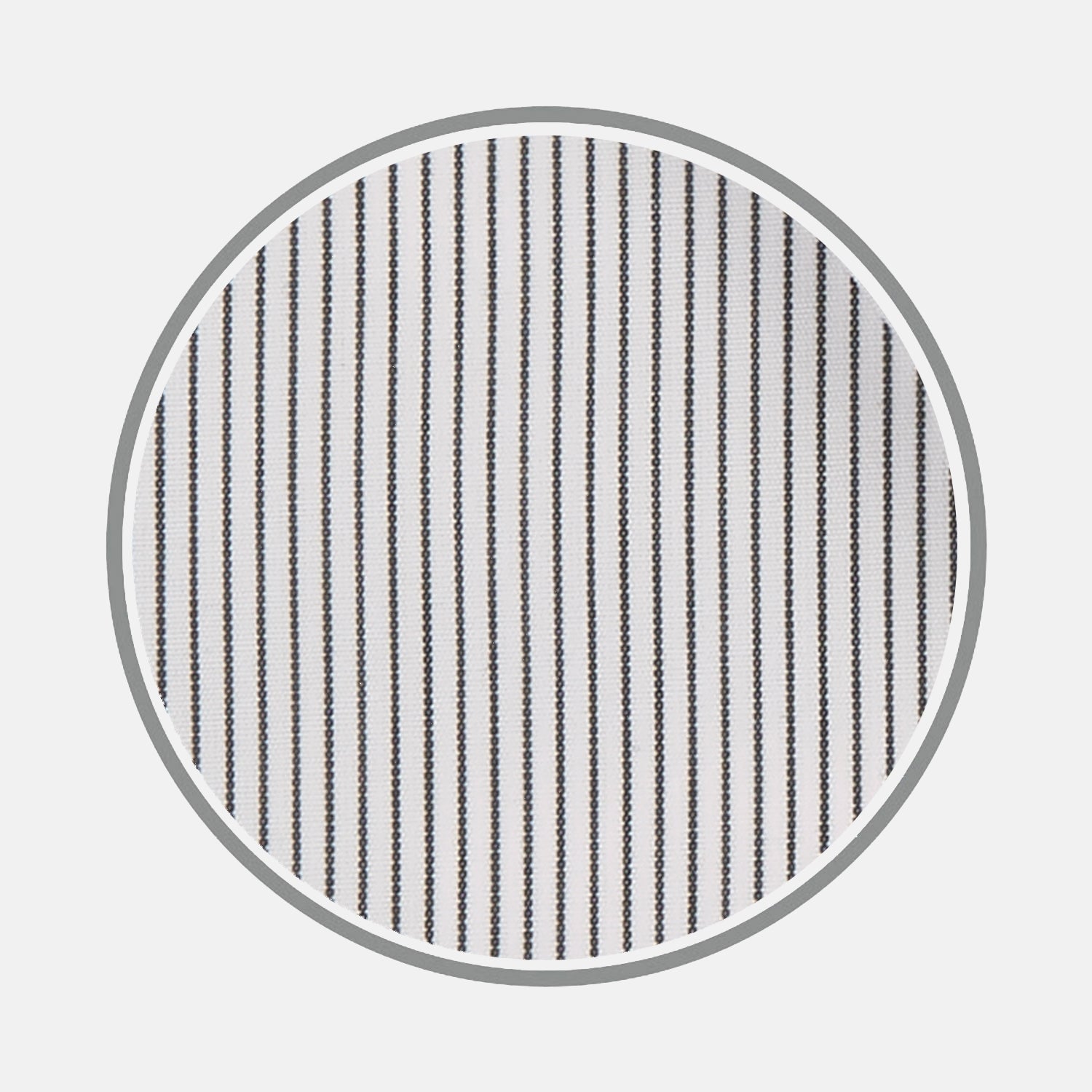 View 2 of product Close-up of Turnbull & Asser's Black Hairline Stripe Cotton Fabric, featuring evenly spaced thin black vertical stripes on white cotton, viewed through a circular frame against a light gray background.