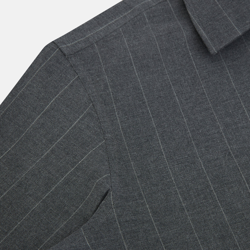 The Charcoal Melange Wide Stripe Westminster Shirt from Turnbull & Asser features long sleeves, a tailored fit, pointed collar, buttoned cuffs, and subtle wide stripes, shown laid flat on a white background.