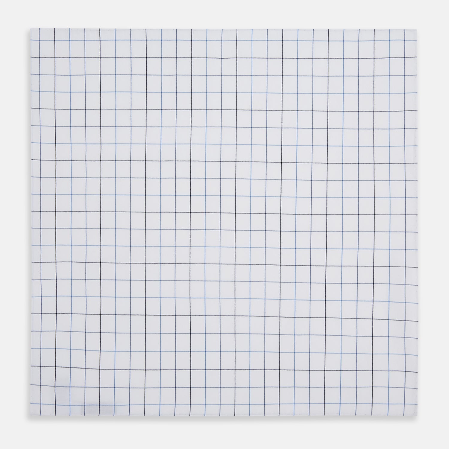 View 3 of product The Turnbull & Asser Hand Rolled Blue Grid Check Handkerchief features a classic blue and black grid on white cotton, neatly folded—a timeless gentleman's accessory.