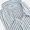 View 2 of product The SAPPHIRE BLUE MULTI TRACK STRIPE WINDSOR SHIRT by Turnbull & Asser features long sleeves, button-up front, classic collar, blue and white vertical stripes, buttoned cuffs, and showcases British craftsmanship on a white background.
