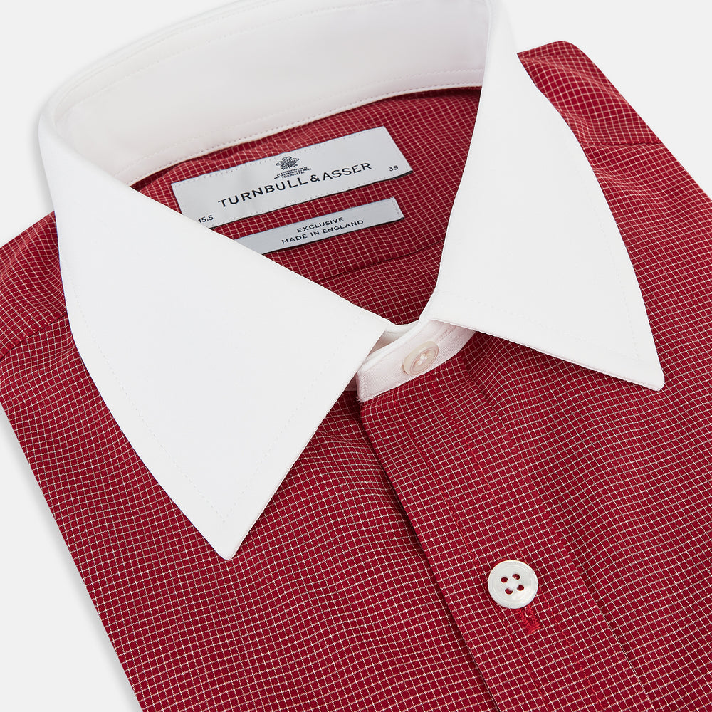 The Turnbull & Asser Dark Red Pin Check Shirt features a crisp white contrast collar and cuffs, with long sleeves and button-up design, shown against a white background.