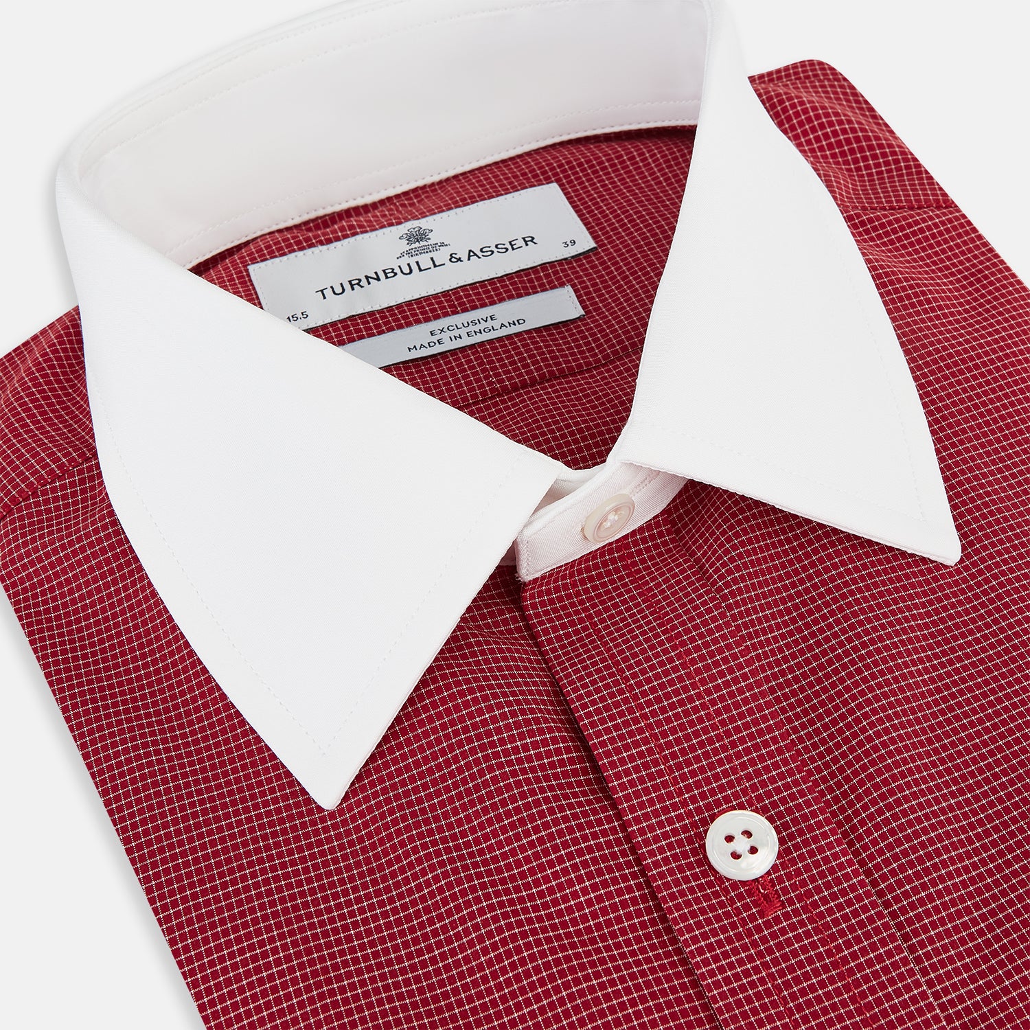 View 2 of product The Turnbull & Asser Dark Red Pin Check Shirt features a crisp white contrast collar and cuffs, with long sleeves and button-up design, shown against a white background.