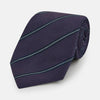 View 1 of product The Turnbull & Asser Purple Multi Stripe Silk Blend Tie, featuring thin light blue diagonal stripes, is neatly rolled on a white background.