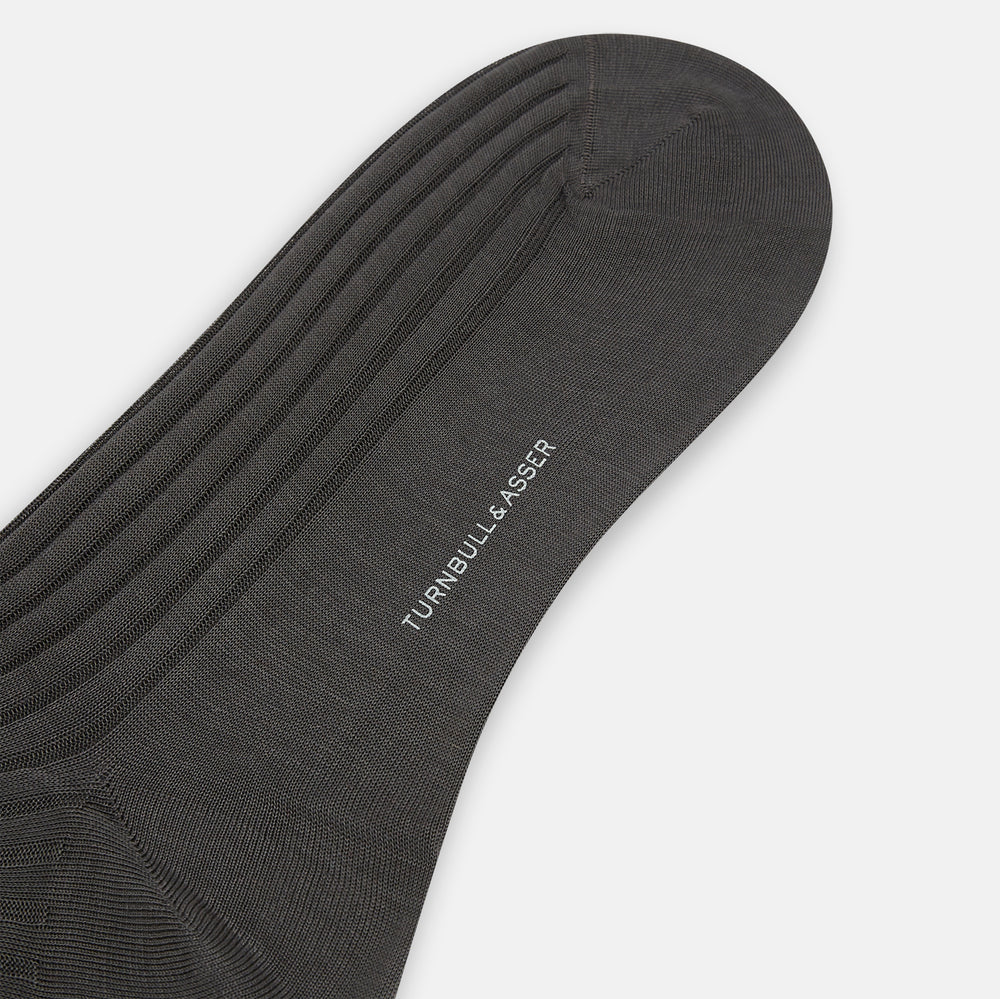 A single Concrete Mid-Length Sock by Turnbull & Asser, crafted from mercerised Egyptian cotton for refined comfort, is shown upright on a white background with the toe pointing left and the cuff at the top.
