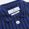 View 4 of product The Turnbull & Asser Blue and Navy Candy Stripe Silk Hyde Pyjamas Set features a long-sleeve button-up top with a chest pocket and elastic-waist pants, shown on a plain white background.