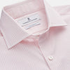 View 2 of product The Turnbull & Asser White and Pink Wide Stripe Shirt with Double Cuffs features a minimalist design, with bold vertical stripes and long sleeves, shown laid flat against a white background.