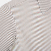 View 6 of product The Turnbull & Asser Coffee Multi Stripe Westminster Shirt features long sleeves, a button-up front, subtle beige and white stripes, a pointed Turnbull collar, and buttoned cuffs—expertly crafted in Britain and shown flat on a white background.