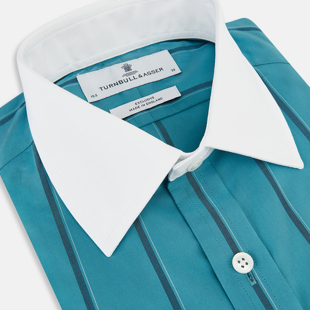 The Turnbull & Asser Turquoise Track Stripe Shirt features a Mayfair fit, contrast white T&A collar and double cuffs, black vertical stripes, and long sleeves, displayed flat on a light background.