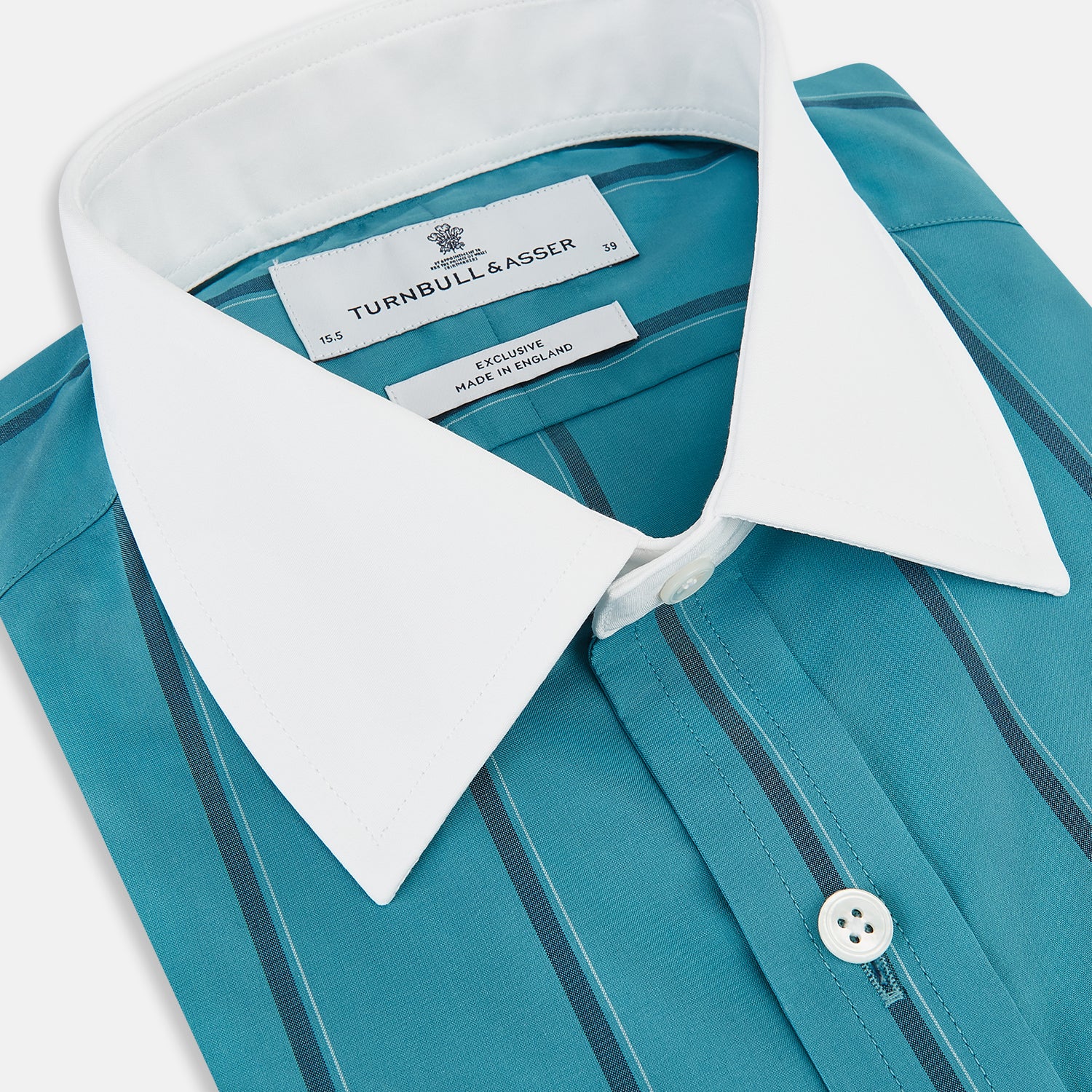 View 2 of product The Turnbull & Asser Turquoise Track Stripe Shirt features a Mayfair fit, contrast white T&A collar and double cuffs, black vertical stripes, and long sleeves, displayed flat on a light background.