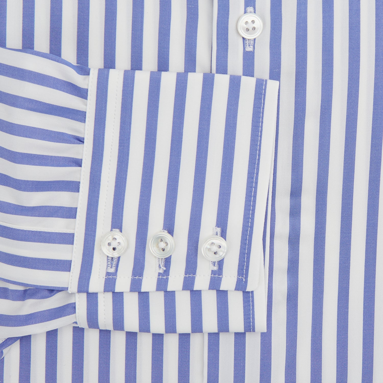 View 4 of product The Turnbull & Asser Tailored Fit Blue and White Candy Stripe Shirt, featuring a Kent collar and 3-button cuffs, is displayed neatly on a white background.