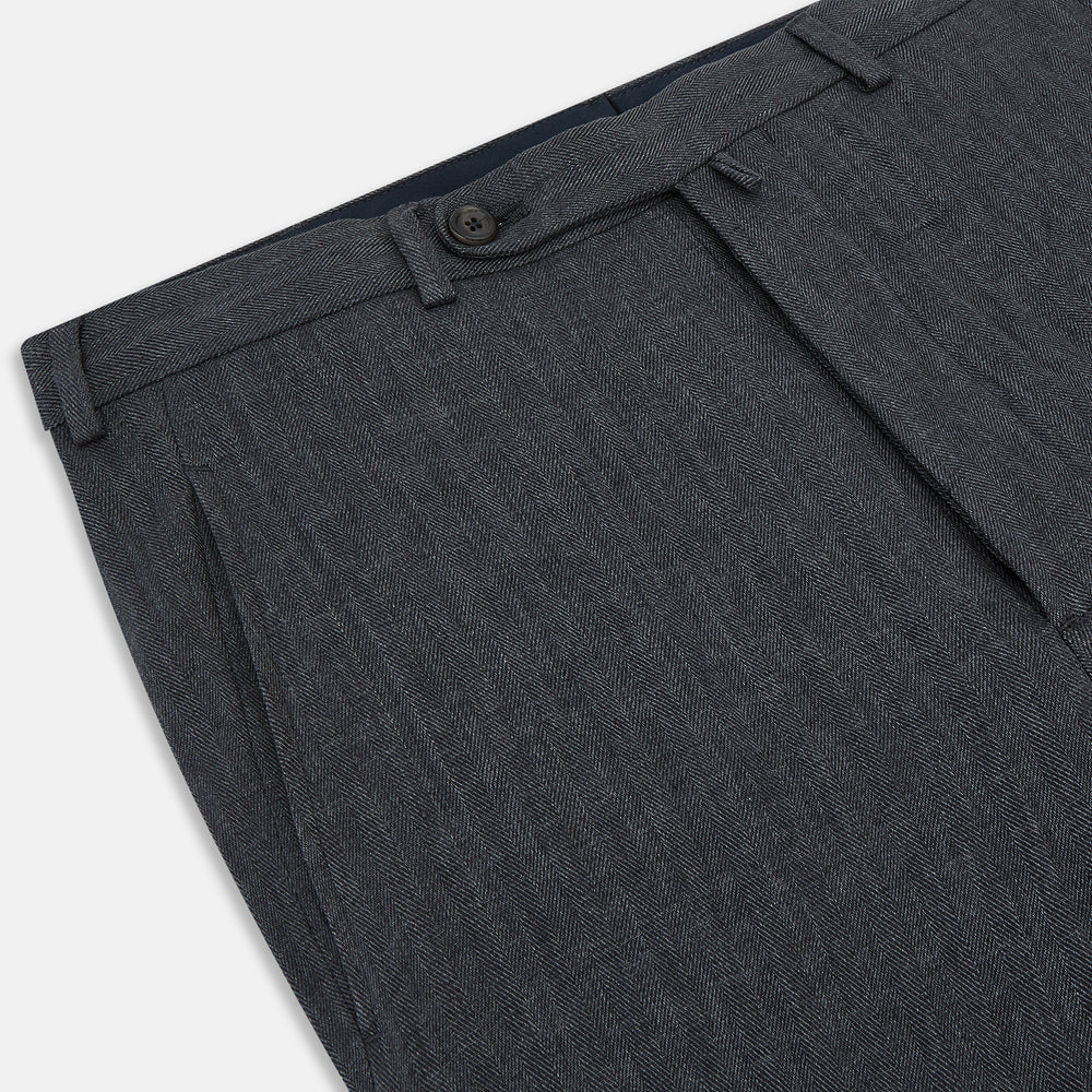 The Ash Linen Herringbone Edmund Trousers by Turnbull & Asser feature a straight-leg fit, button closure, belt loops, and side pockets in summer-ready fabric—ideal for utility dressing—shown against a plain white background.