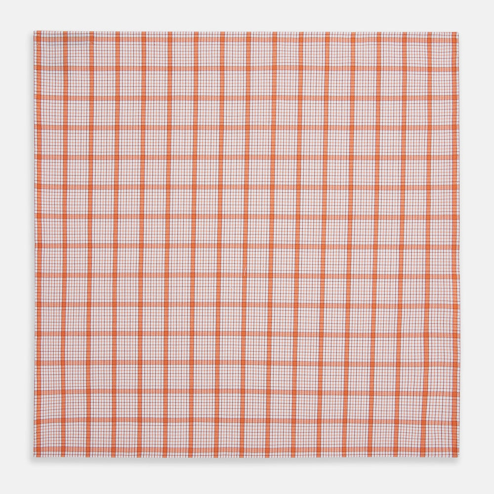 The Turnbull & Asser Hand Rolled Orange Graph Overlay Check Handkerchief features bold orange and white checks with blue and orange grid lines—a refined, classic accessory for any gentleman.