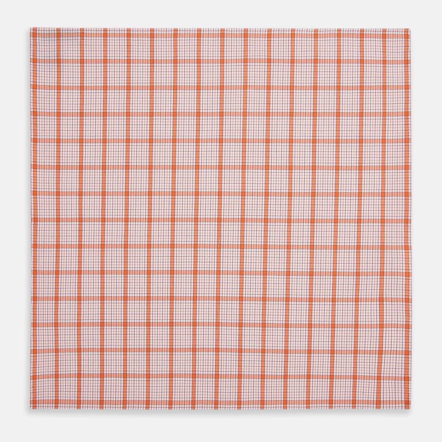 View 3 of product The Turnbull & Asser Hand Rolled Orange Graph Overlay Check Handkerchief features bold orange and white checks with blue and orange grid lines—a refined, classic accessory for any gentleman.