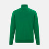 View 3 of product The Turnbull & Asser Hunter Green Fine Merino High Neck Jumper features a classic long-sleeve turtleneck style, crafted from soft merino wool and displayed against a crisp white background.