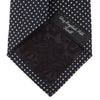 View 4 of product The Turnbull & Asser Black and White Small Spot Printed Silk Tie, shown rolled against a white background, features a subtle polka dot pattern—an ideal accessory for any office shirt.
