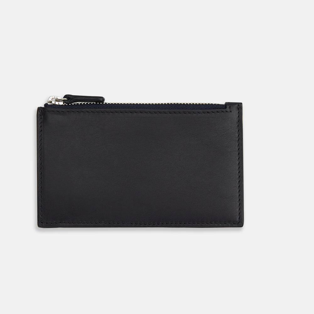 A navy leather card holder by Turnbull & Asser, featuring four card slots, a zip coin pocket, and the brand name embossed in white on the lower left corner.
