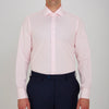 View 2 of product The Turnbull & Asser Pink Poplin Slim Fit Regent Collar Shirt features white buttons and a slim fit label, neatly folded and displayed on a plain white background.