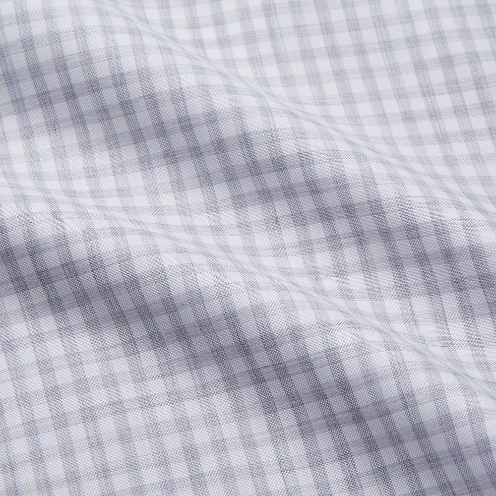 The Grey Check Cotton Melange Regular Fit Mayfair Shirt by Turnbull & Asser features a light gray and white small checkered pattern, a collar, and front buttons, shown against a white background.