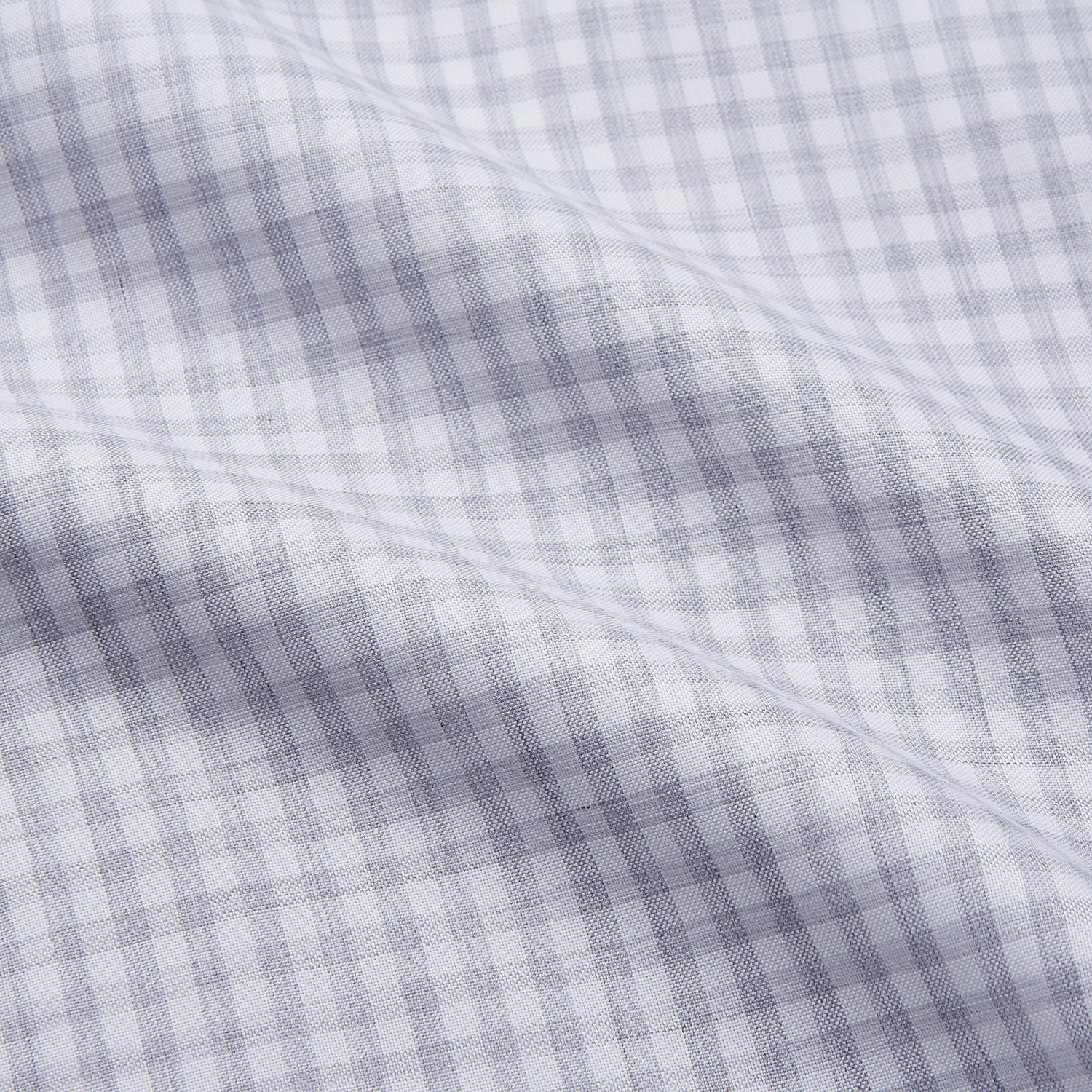 View 4 of product The Grey Check Cotton Melange Regular Fit Mayfair Shirt by Turnbull & Asser features a light gray and white small checkered pattern, a collar, and front buttons, shown against a white background.