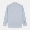 View 5 of product Turnbull & Asser’s Pale Blue Linen Blend Weekend Fit Unwin Shirt features long sleeves, a band collar, two chest pockets, and white buttons—ideal for casual summer wear.