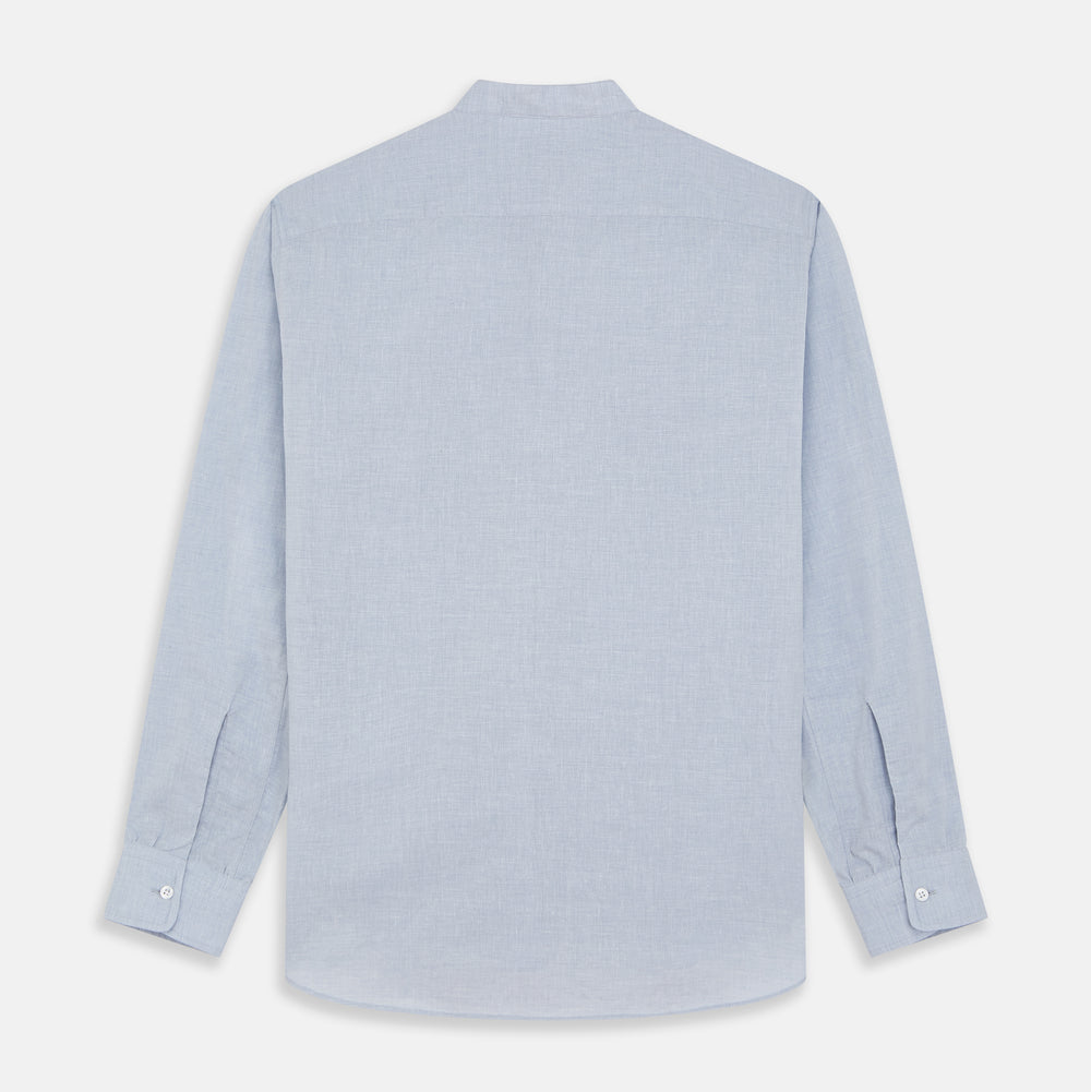 Turnbull & Asser’s Pale Blue Linen Blend Weekend Fit Unwin Shirt features long sleeves, a band collar, two chest pockets, and white buttons—ideal for casual summer wear.