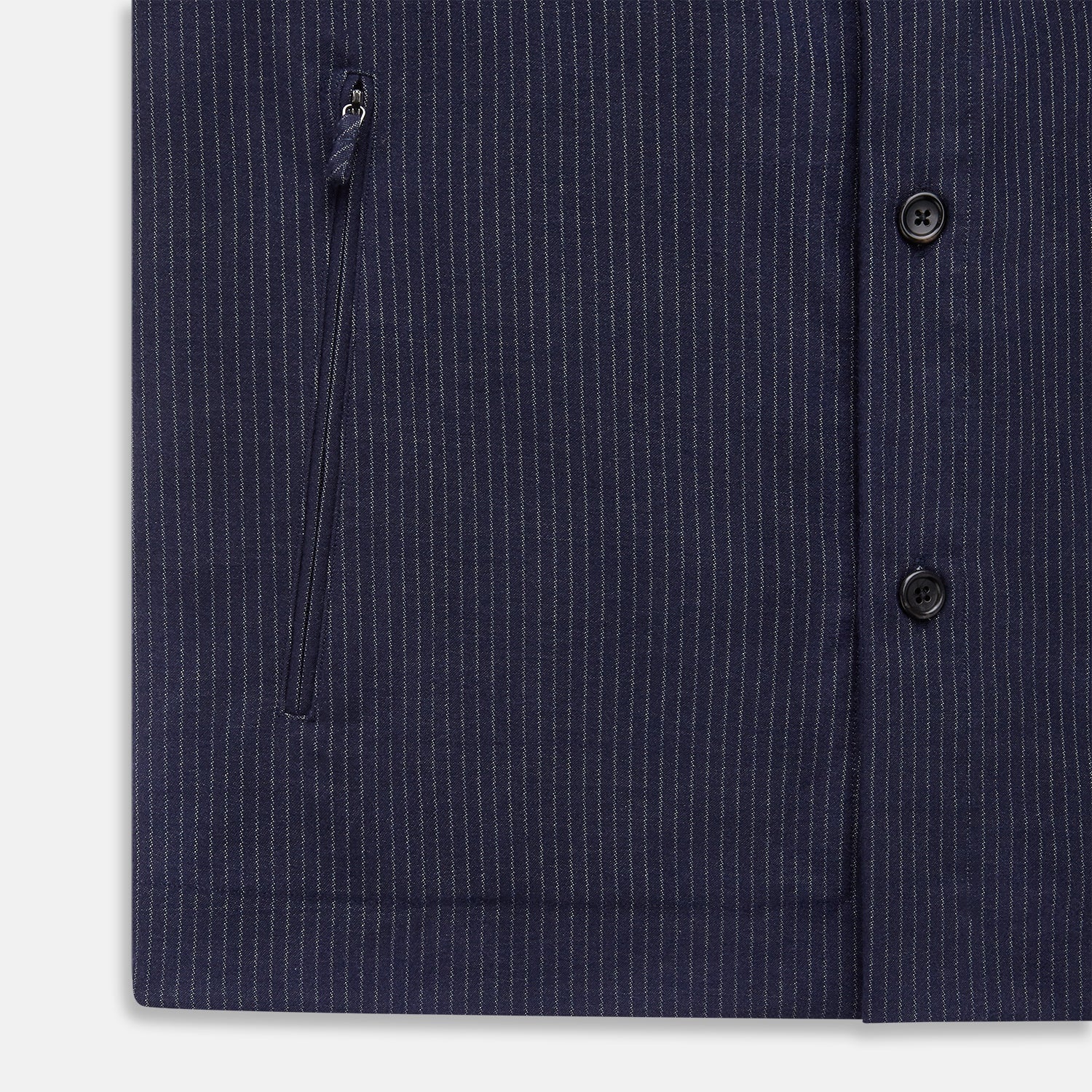 View 7 of product The Turnbull & Asser Navy Stripe Hampstead Overshirt features pinstripes, a collar, long sleeves, chest pocket, and two angled side pockets—ideal for refining your formal look. Shown laid flat on a light background.