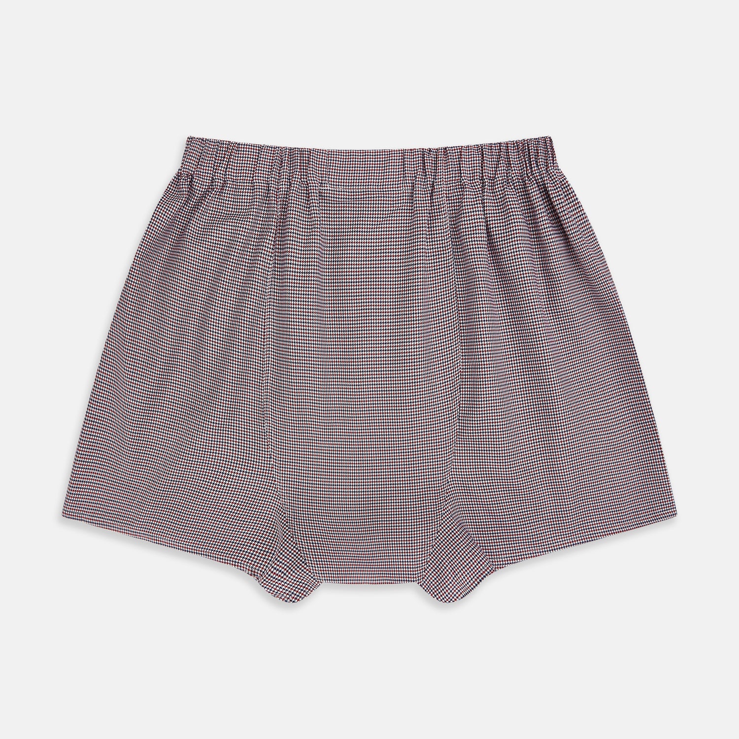 View 2 of product The Turnbull & Asser Burgundy Houndstooth Godfrey Boxer Shorts are luxury men's underwear made from Italian cotton, featuring an elastic waistband and a small maroon and white houndstooth pattern.