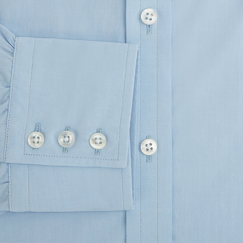 The Turnbull & Asser Sky Blue Mayfair Shirt is a long-sleeved, collared button-down made from sanforised cotton, shown laid flat on a white background.