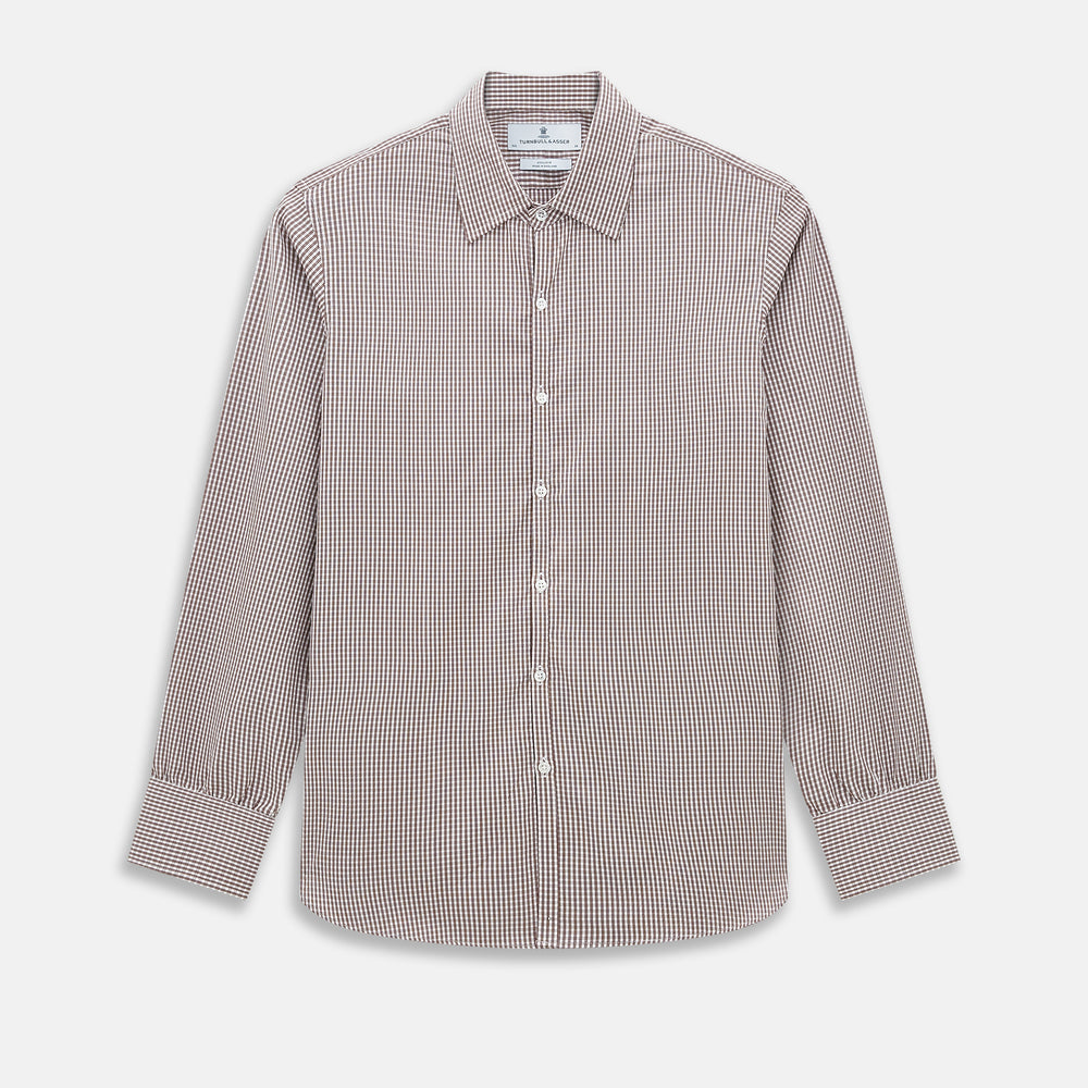 The Turnbull & Asser Burgundy Micro Check Westminster Shirt is a long-sleeved button-up with a classic collar and tailored fit, featuring a subtle micro check pattern, shown against a white background.