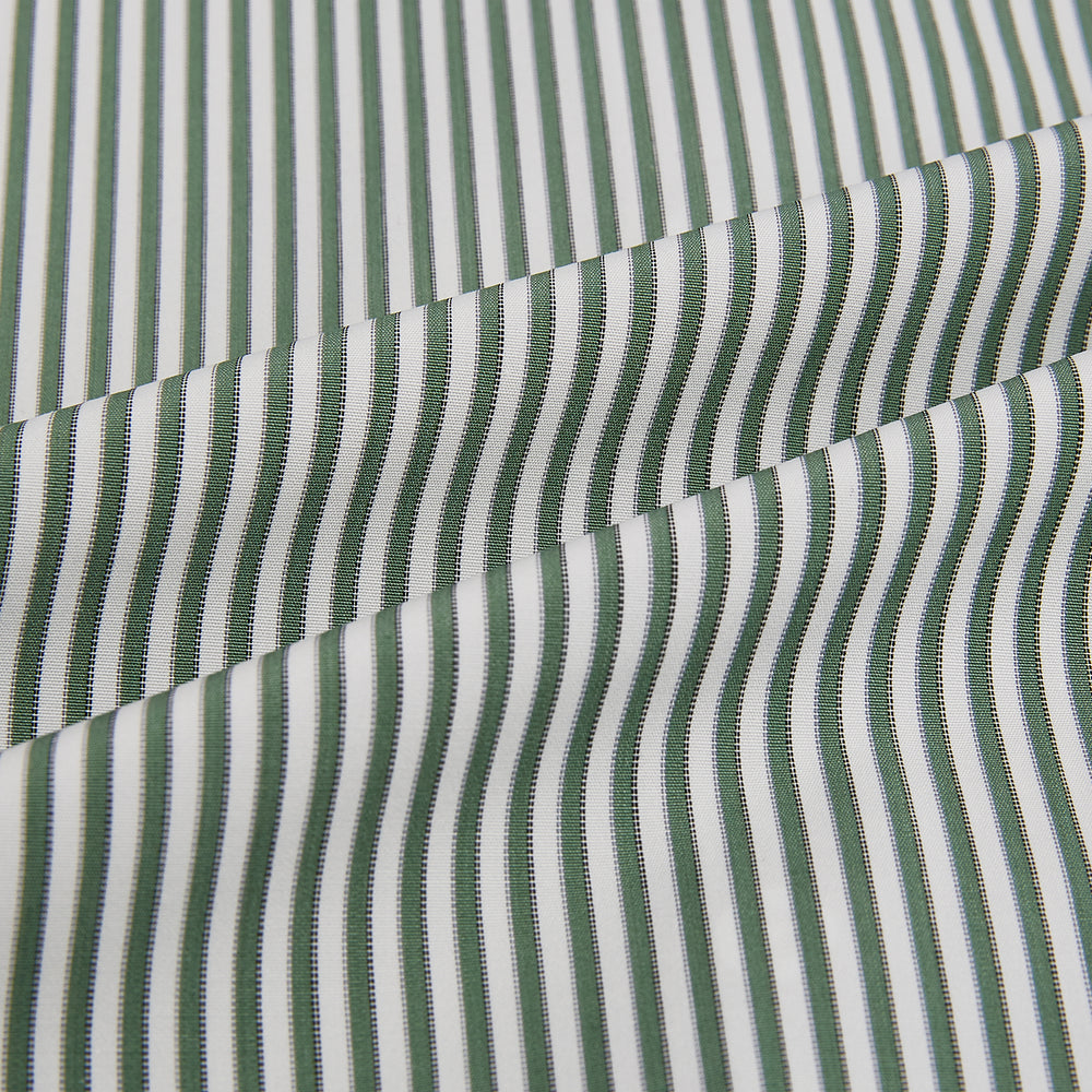 The Melon Green Halo Stripe Westminster Shirt by Turnbull & Asser, featuring thin green and white stripes and a classic Turnbull collar, is displayed against a plain white background—a testament to refined British craftsmanship.