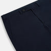 View 2 of product Turnbull & Asser’s Midnight Blue Winston Trousers, in high-twist cotton with belt loops and a button closure, are shown flat against a plain white background.