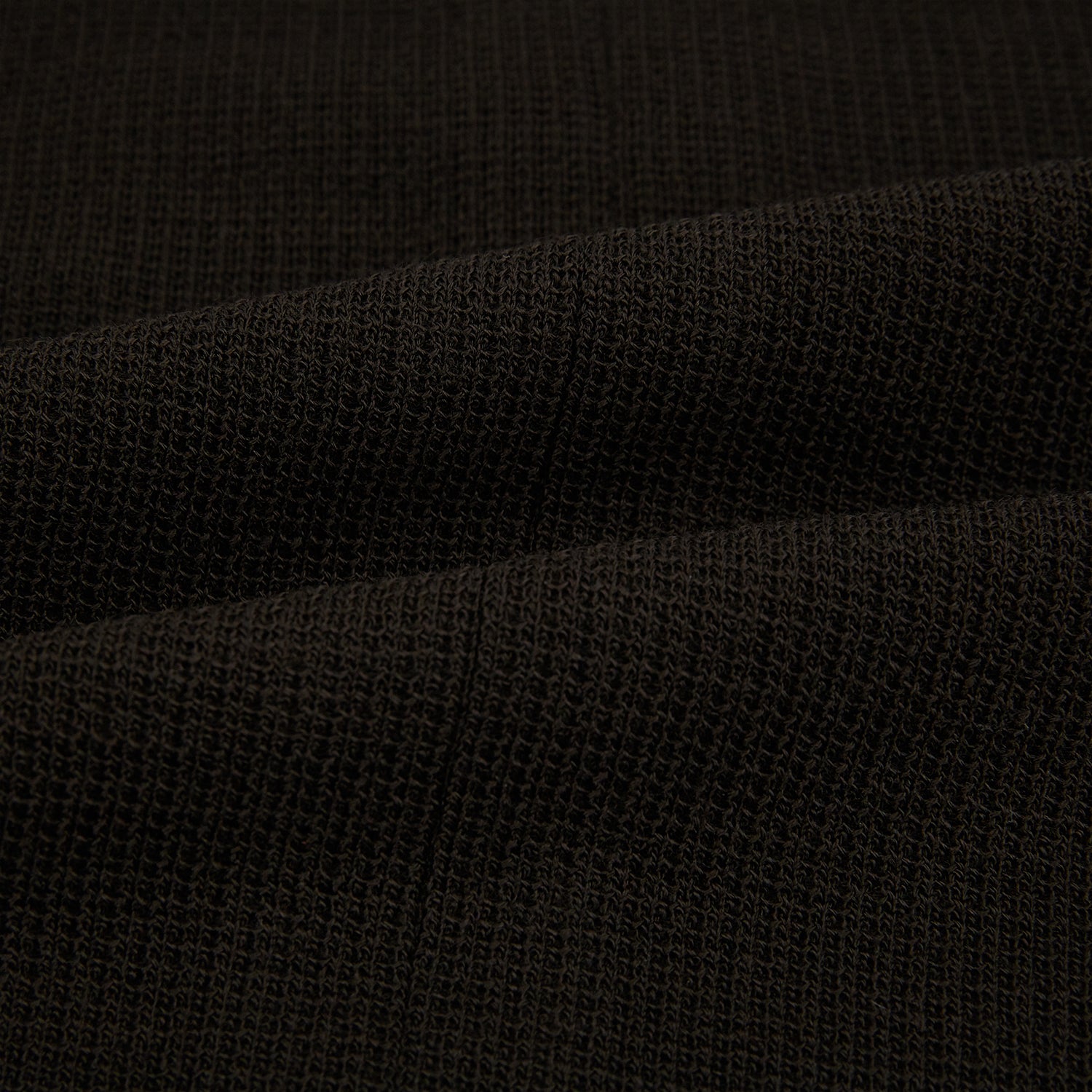 View 5 of product The Turnbull & Asser Dark Chocolate Greenwich Knitted Overshirt is crafted from Italian wool, with a classic collar, two flap chest pockets, and a concealed button front—offering a sleek cardigan alternative. Shown on a white background.