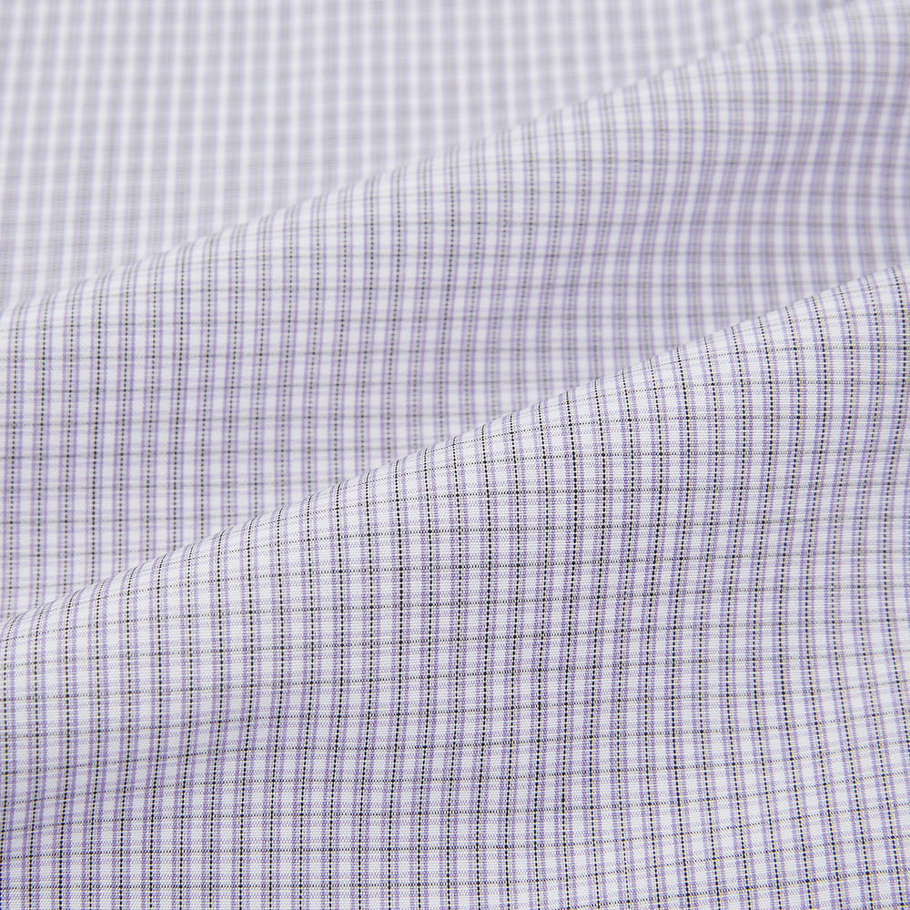 The Turnbull & Asser Purple Micro Check Mayfair Shirt features long sleeves, button-up front, pointed collar, and buttoned cuffs in a subtle lilac and white check, exemplifying British craftsmanship and displayed on a white background.