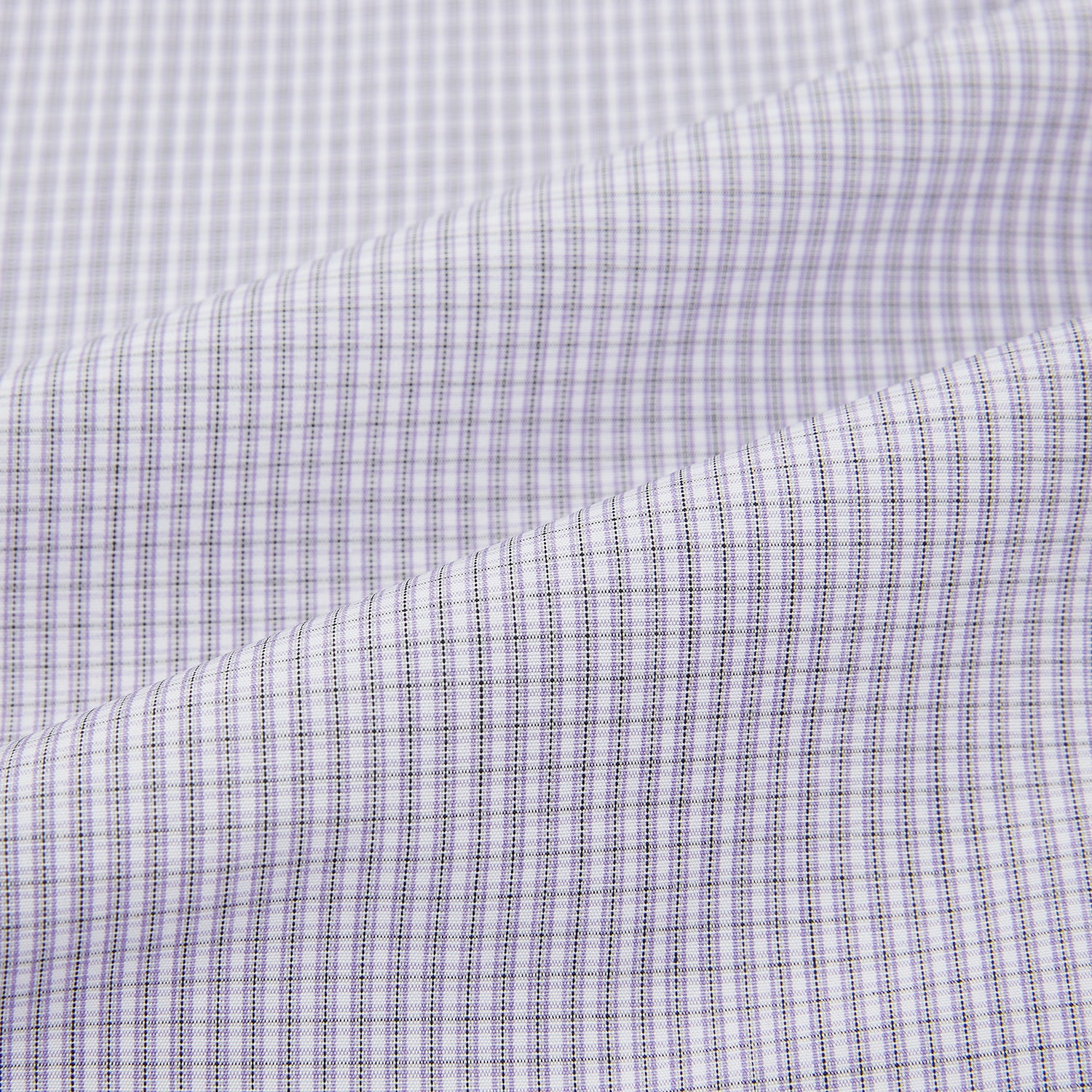 View 6 of product The Turnbull & Asser Purple Micro Check Mayfair Shirt features long sleeves, button-up front, pointed collar, and buttoned cuffs in a subtle lilac and white check, exemplifying British craftsmanship and displayed on a white background.