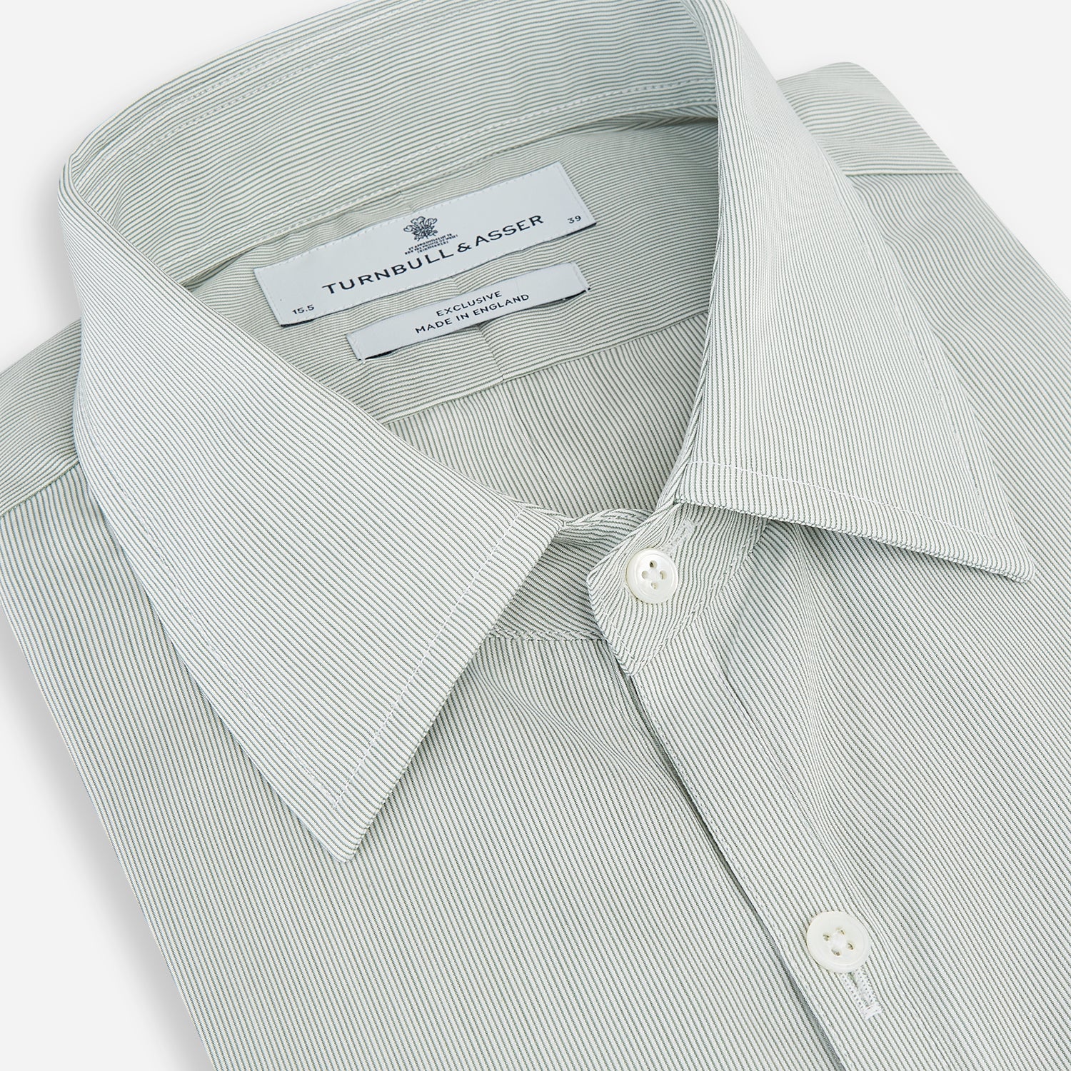 View 2 of product A dark green hairline stripe Westminster shirt by Turnbull & Asser, featuring long sleeves, a classic collar, tailored fit, white front buttons, and buttoned cuffs, laid flat on a white background.
