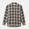 View 1 of product The Brown Multi Check Linen Weekend Fit Unwin Shirt by Turnbull & Asser features a beige, brown, and black plaid pattern, stand collar, button-up front, long sleeves, and two buttoned chest pockets.