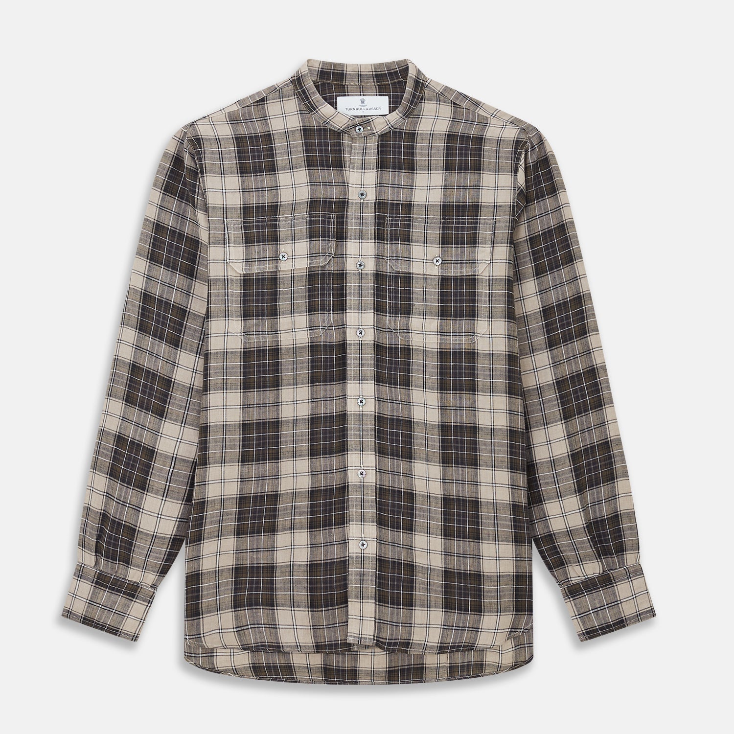 View 1 of product The Brown Multi Check Linen Weekend Fit Unwin Shirt by Turnbull & Asser features a beige, brown, and black plaid pattern, stand collar, button-up front, long sleeves, and two buttoned chest pockets.