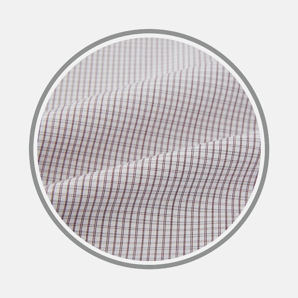 Close-up of Turnbull & Asser Burgundy Micro Tattersall Fabric, featuring a white background with thin, evenly spaced red and blue lines in a grid pattern. The fabric is slightly folded to showcase its texture.