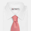 View 2 of product The HOUNDSTOOTH WHITE TULIP RED TIE by Turnbull & Asser features a refined red and white houndstooth pattern—an elegant accessory that elevates any crisp shirt or formal look.