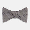 View 1 of product The Turnbull & Asser Navy and Silver Micro Dot Silk Bow Tie, featuring a refined dot pattern, is displayed on a white background.
