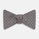 The Turnbull & Asser Navy and Silver Micro Dot Silk Bow Tie, featuring a refined dot pattern, is displayed on a white background.