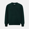 View 1 of product The Turnbull & Asser Petrol Green Merino V-Neck Jumper features long sleeves and ribbed cuffs and hem—an essential knitwear piece, shown against a white background.