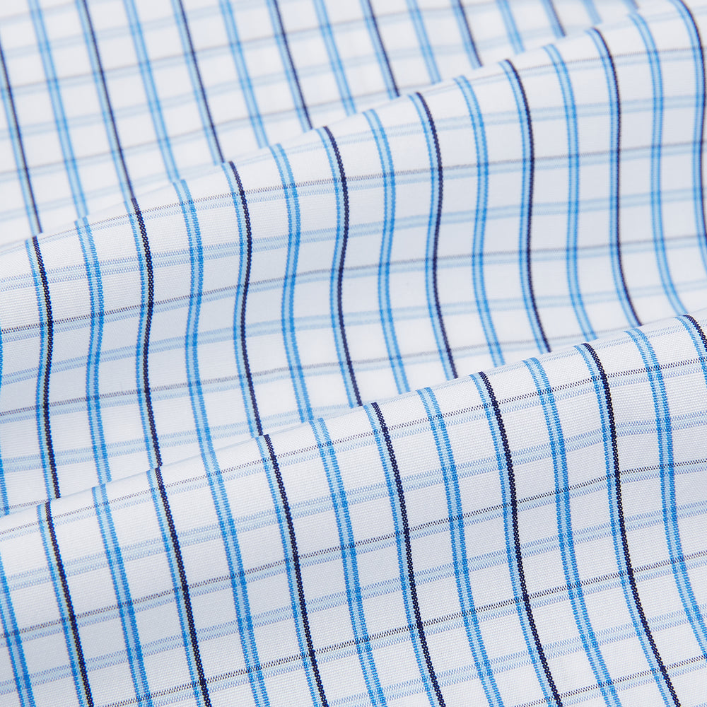 The Turnbull & Asser Blue and Navy Tattersall Check Mayfair Shirt features long sleeves, a button-up front, and a T&A collar in the classic Mayfair fit, shown flat against a white background.