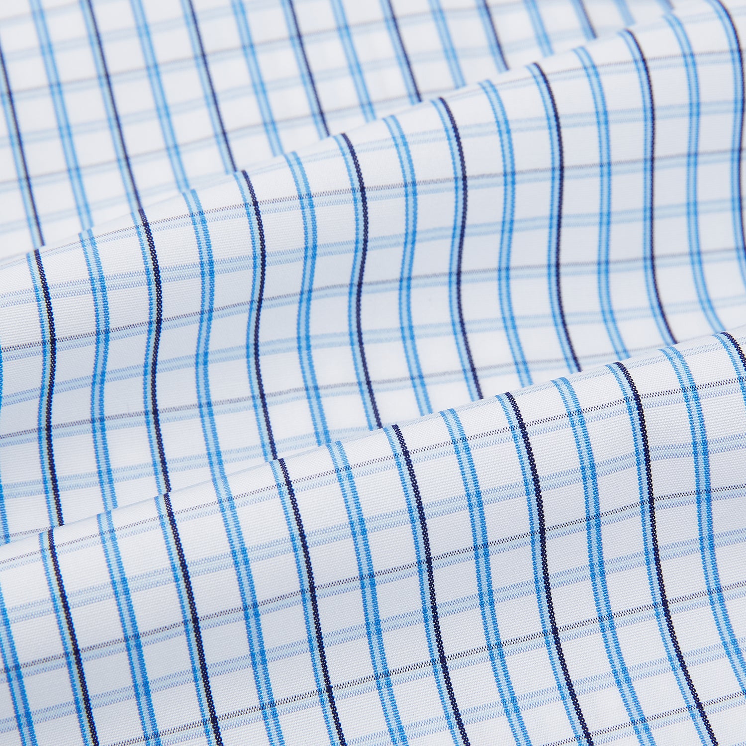 View 6 of product The Turnbull & Asser Blue and Navy Tattersall Check Mayfair Shirt features long sleeves, a button-up front, and a T&A collar in the classic Mayfair fit, shown flat against a white background.