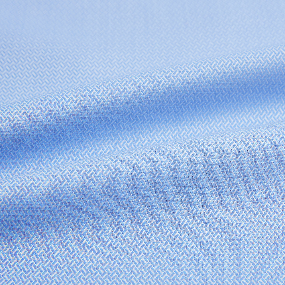 The Blue Herringbone Mayfair Shirt by Turnbull & Asser features light blue and white stripes, long sleeves, a classic collar, white buttons, and buttoned cuffs. Shown on a plain white background, it's perfect for formal occasions.