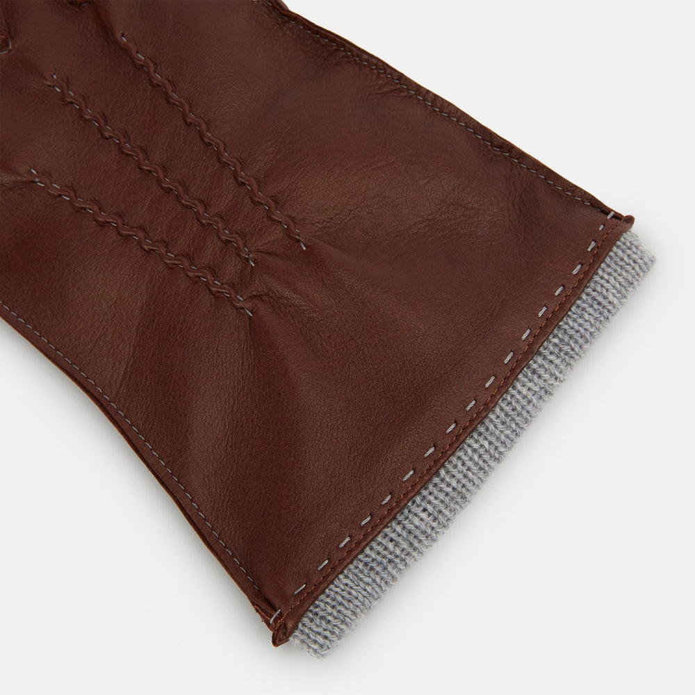 Turnbull & Asser's Dark Chocolate/Grey Cashmere-Lined Hairsheep Leather Gloves are shown on a white background, with one glove displaying the palm and the other the back.