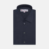 View 1 of product A neatly folded Turnbull & Asser Dark Blue Denim-Cashmere Shirt with a T&A collar and double cuffs, featuring black buttons, shown on a white background. The label inside the collar highlights its smart finish and refined style.